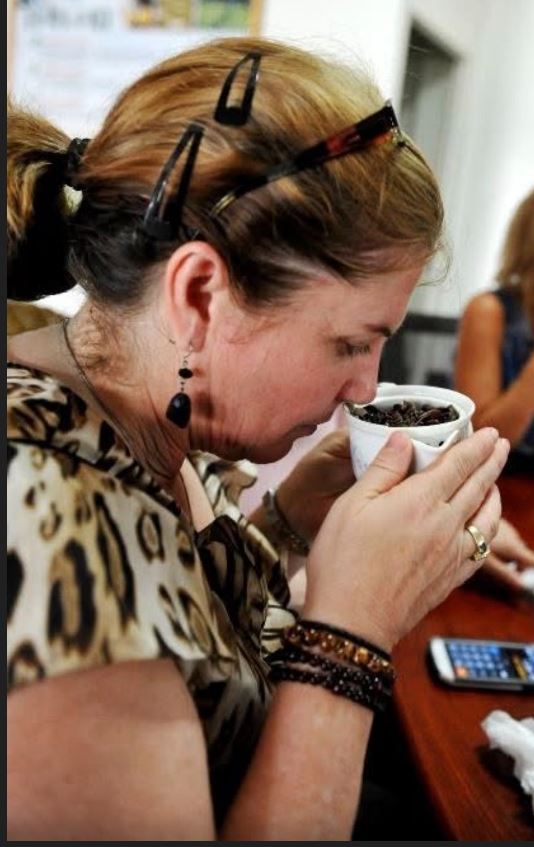 Michele Beutler drawing in the aroma of whole-leaf tea steeping in a cup